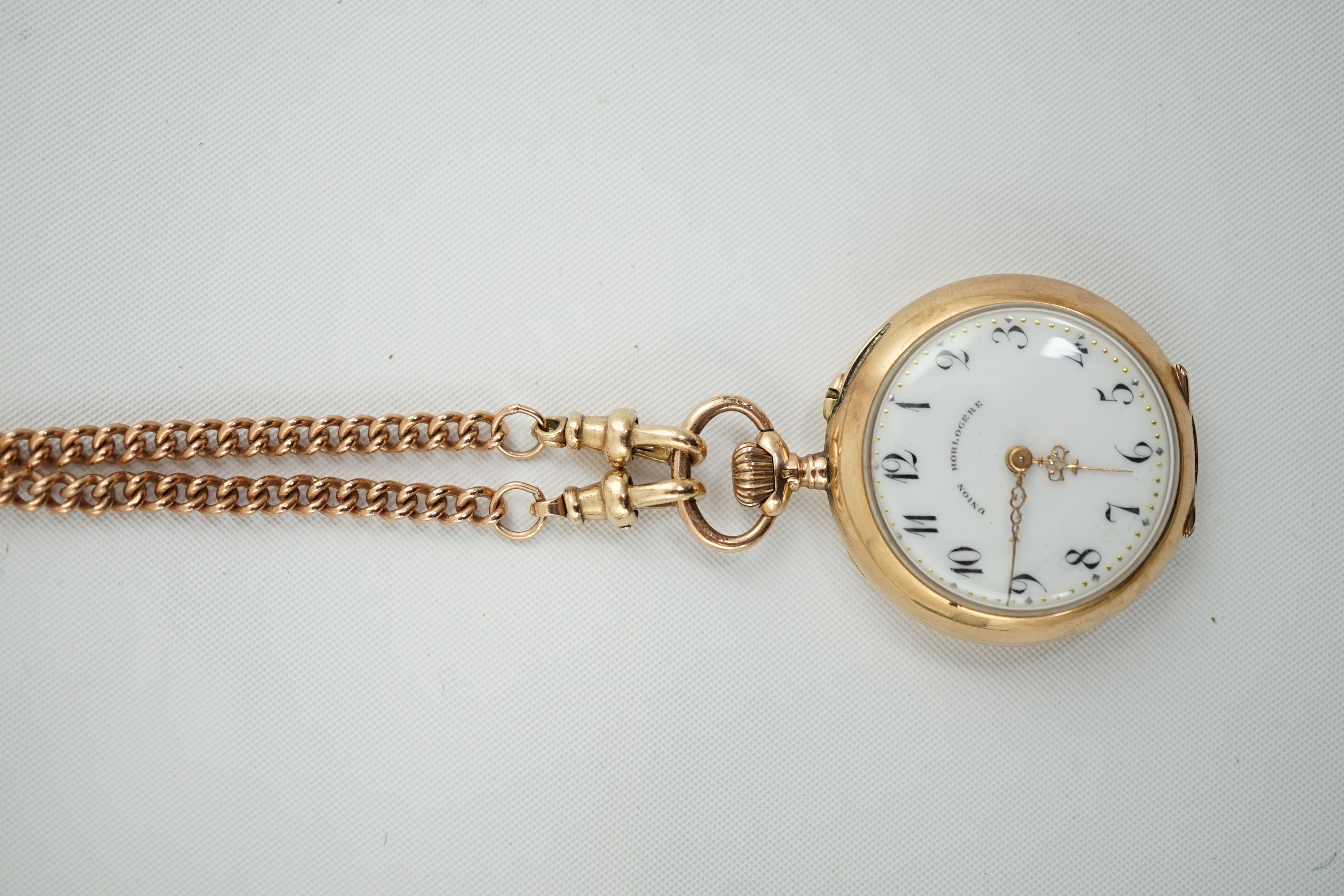 A Swiss 14k gold keyless open face fob watch